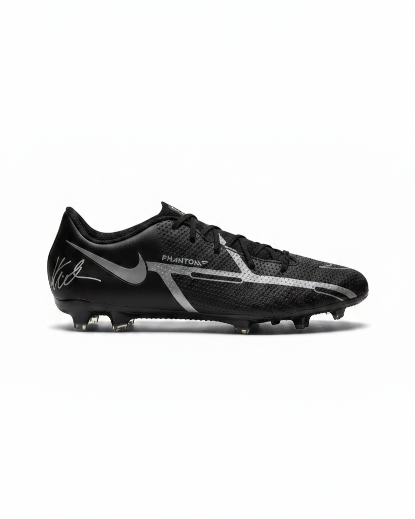 Black and gray soccer cleat with Nike logo on a white background