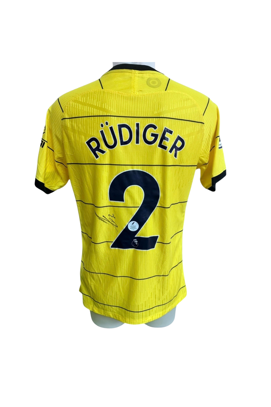 Front of the yellow Chelsea away replica shirt signed by Antonio Rudiger