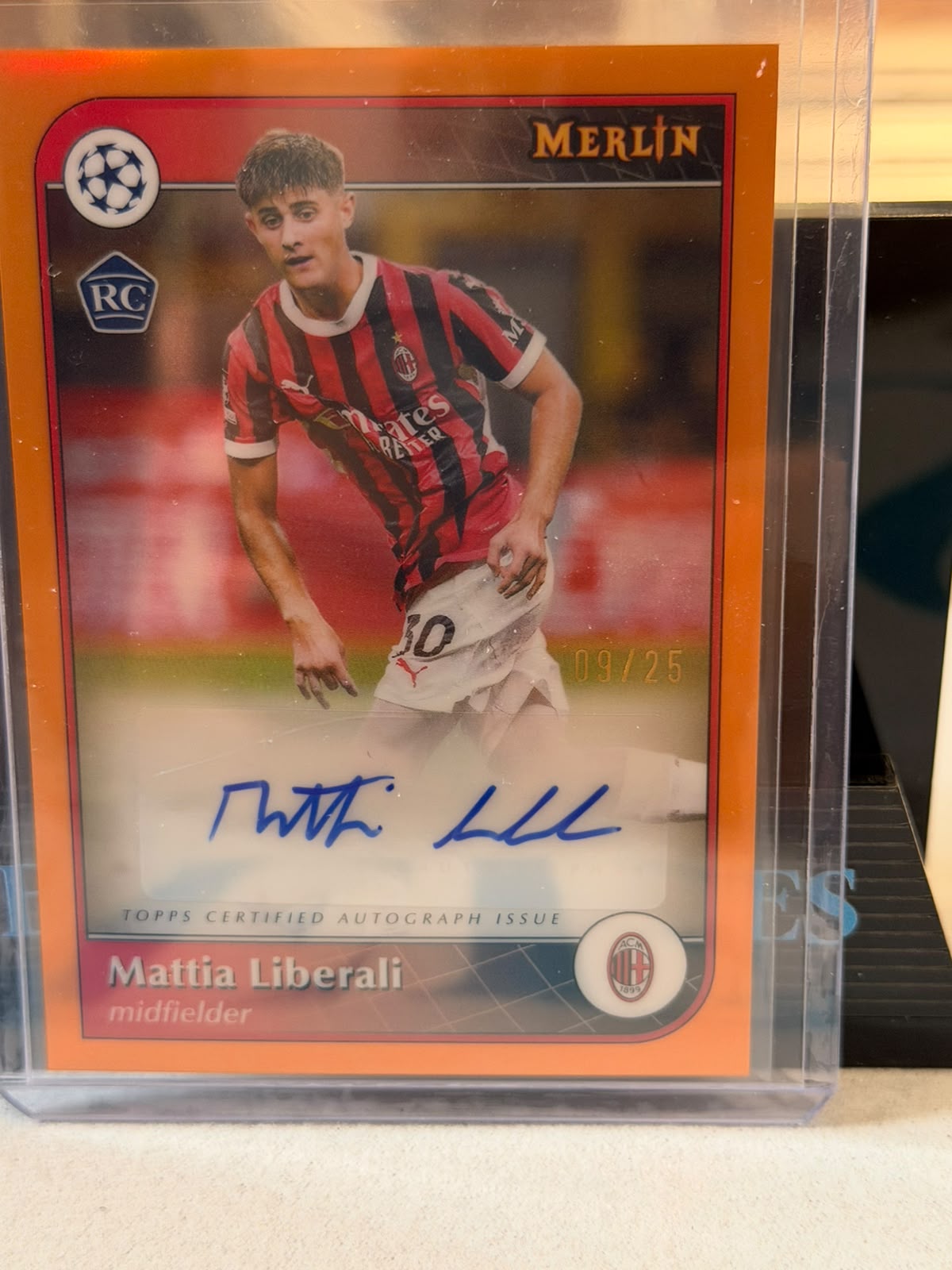 Mattia Liberali Orange Refractor Autograph (RC) – 2024-25 Topps Merlin UEFA Club Competitions – AC Milan trading card, front