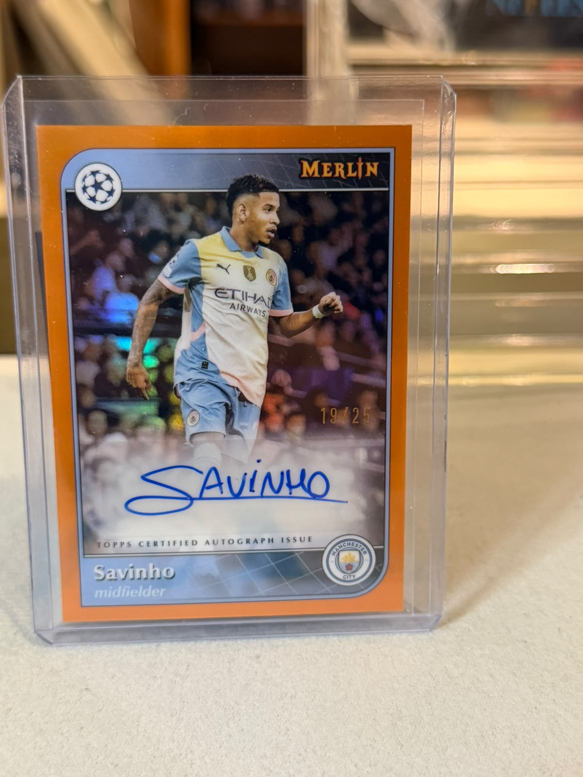 Savinho 19/25 – Merlin Autograph (Orange Refractor) – 2024-25 Topps Merlin Collections… – Manchester City trading card, front