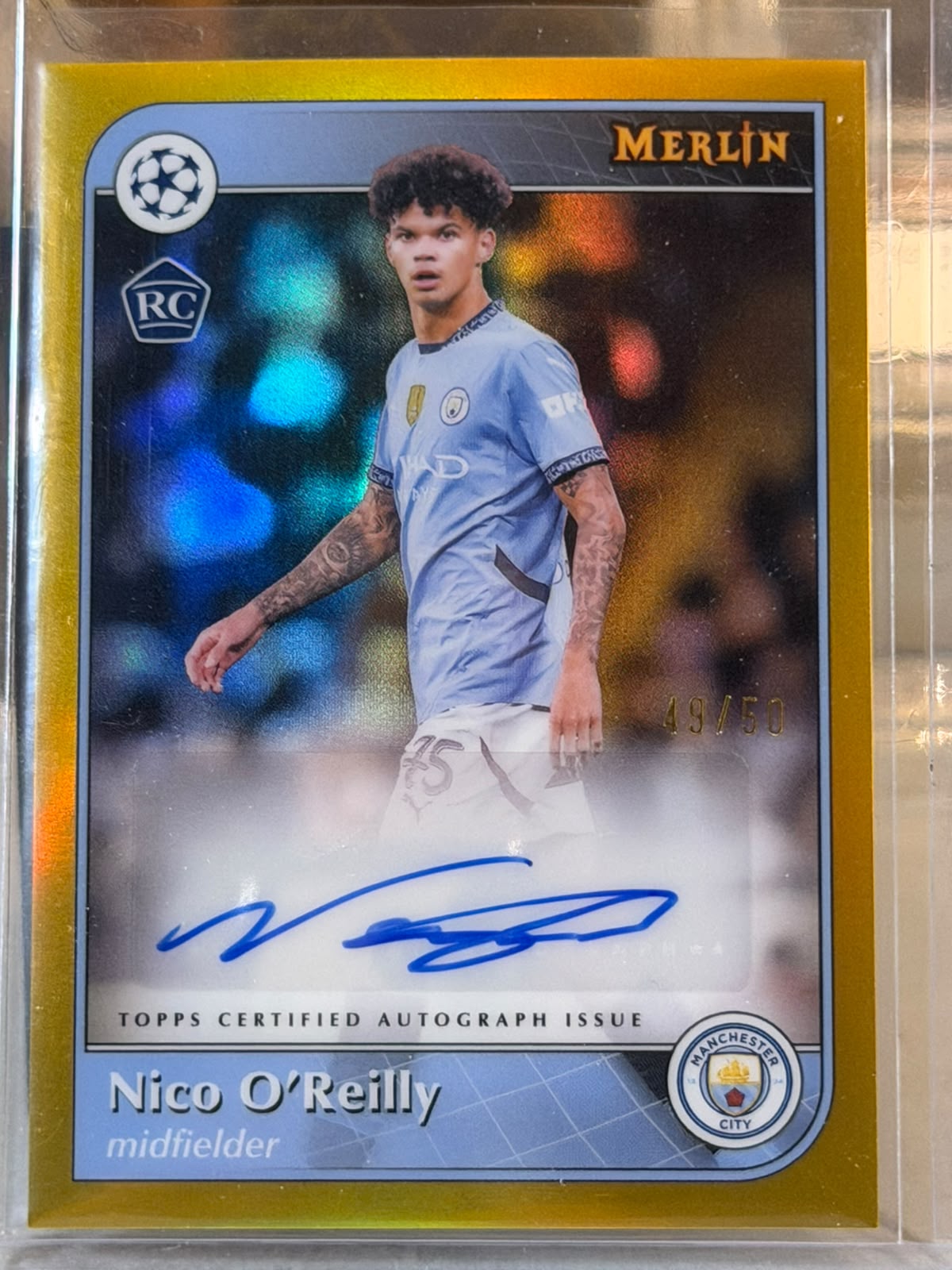 Nico O'Reilly 49/50 – Autographs (Gold) – 2024-25 Topps Merlin UEFA Club Competitions – Manchester City trading card, front