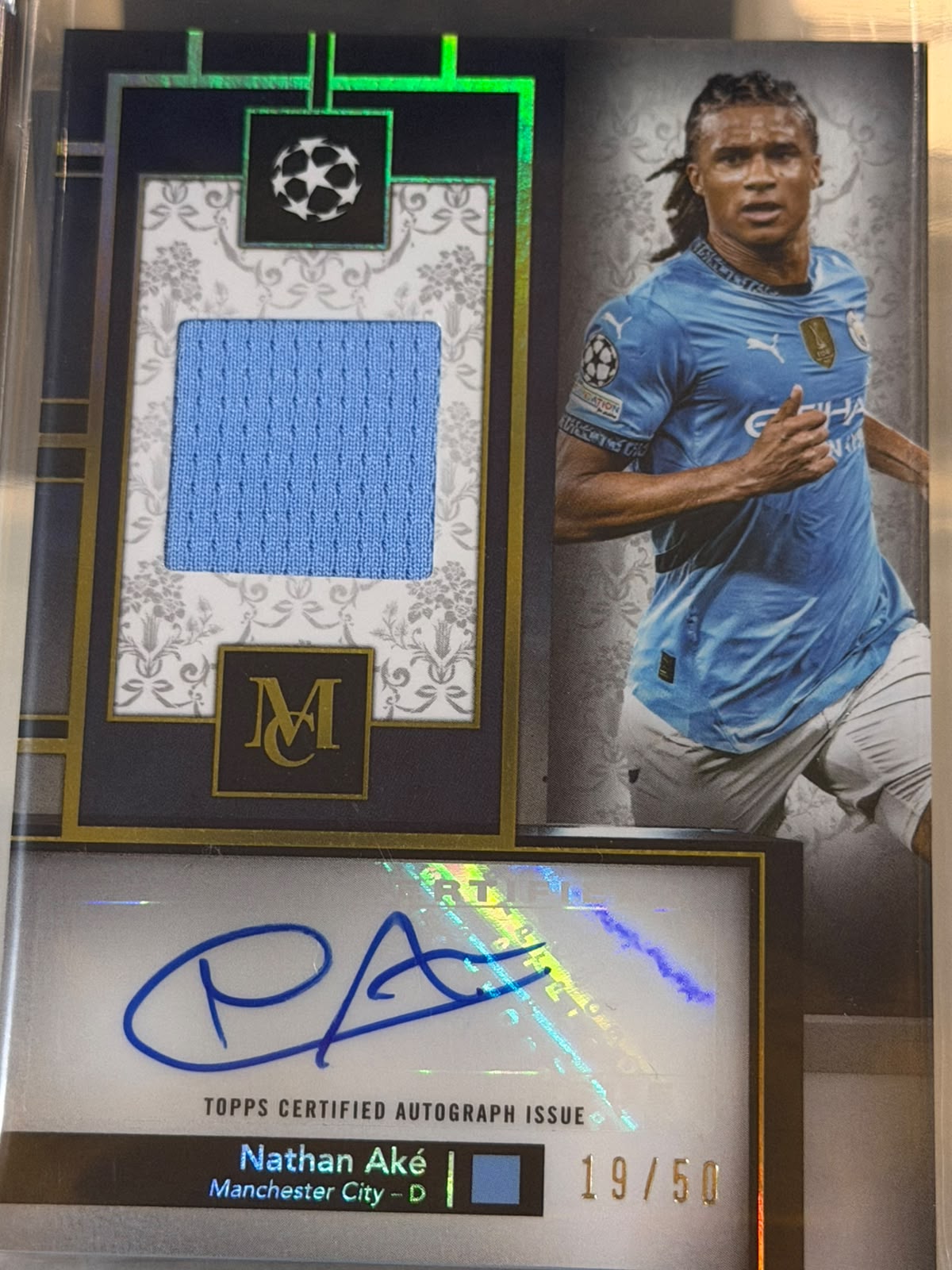 Nathan Ake 19/50 – Museum Autograph Relics – 2024-25 Topps Museum Collection UEFA Club… – Manchester City trading card, front