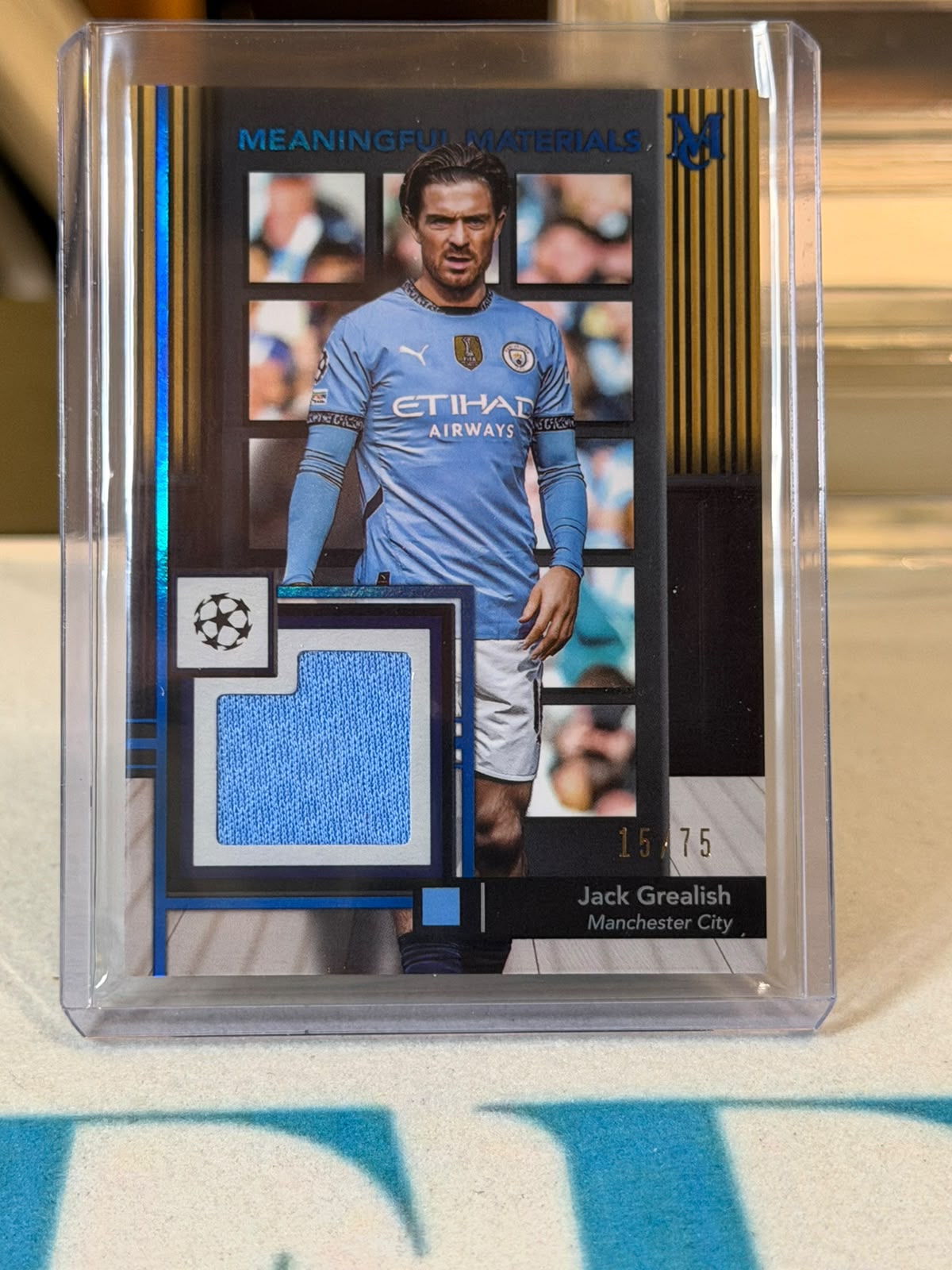 Jack Grealish 15/75 – Meaningful Materials – 2024-25 Topps Museum Collection UEFA Club… – Manchester City trading card, front