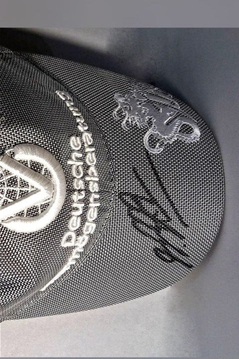 Back of the DVAG Driver's Cap signed by Michael Schumacher