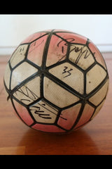 Close-up of the Juventus players' signatures on the match ball