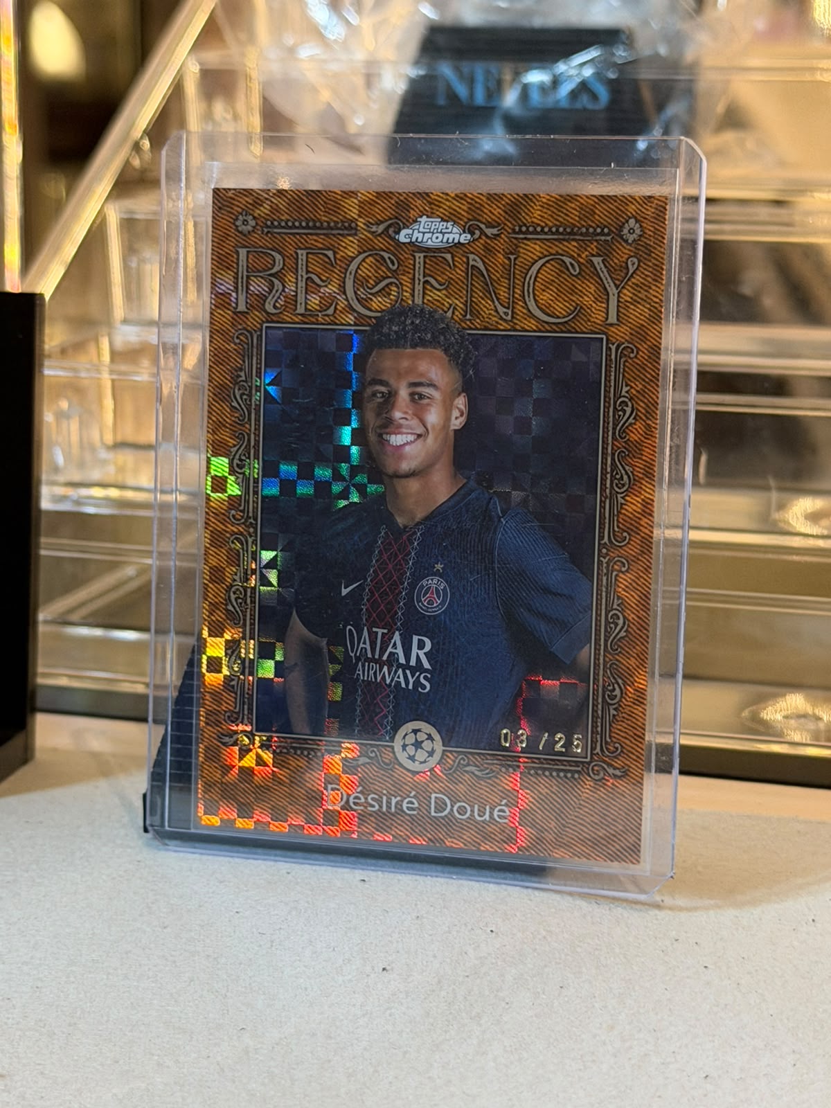 Désiré Doué C0000597 front - Désiré Doué 03/25 #RC-20 – Paris Saint-Germain – Regency Orange Refractor – 2025-26 Topps Chrome UEFA Club Competitions