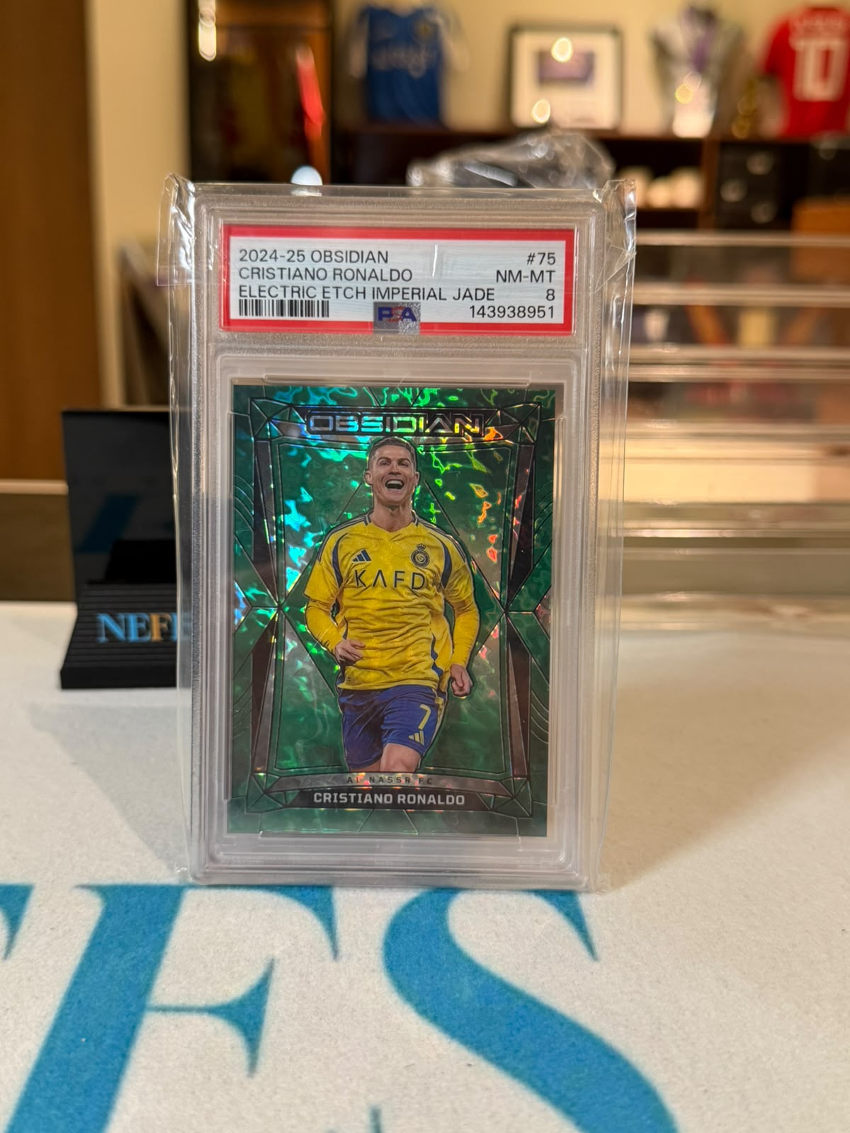 Cristiano Ronaldo 18/26 Electric Etch Imperial Jade 2024-25 Panini Obsidian #75 front PSA 8
