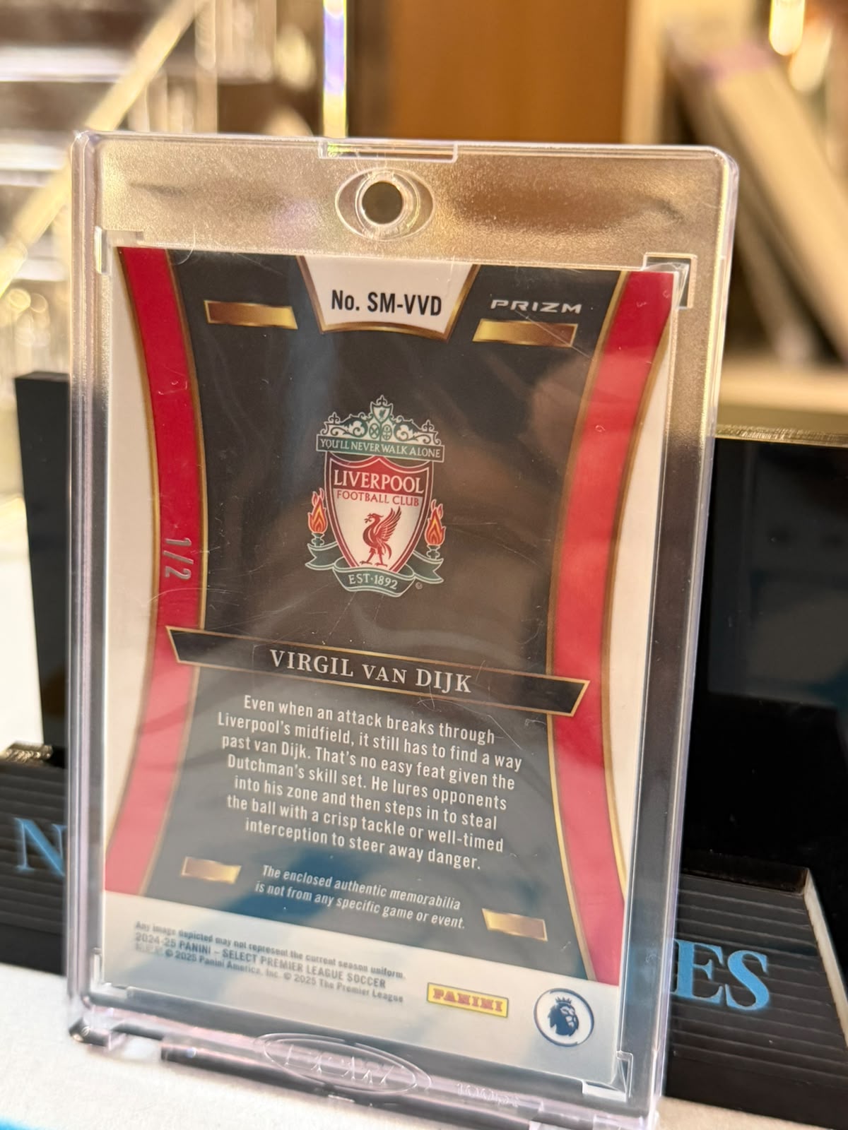 Virgil van Dijk 1/2 Prizm Memorabilia relic (SM-VVD), crest die-cut – 2024-25 Panini Select PL Soccer, back