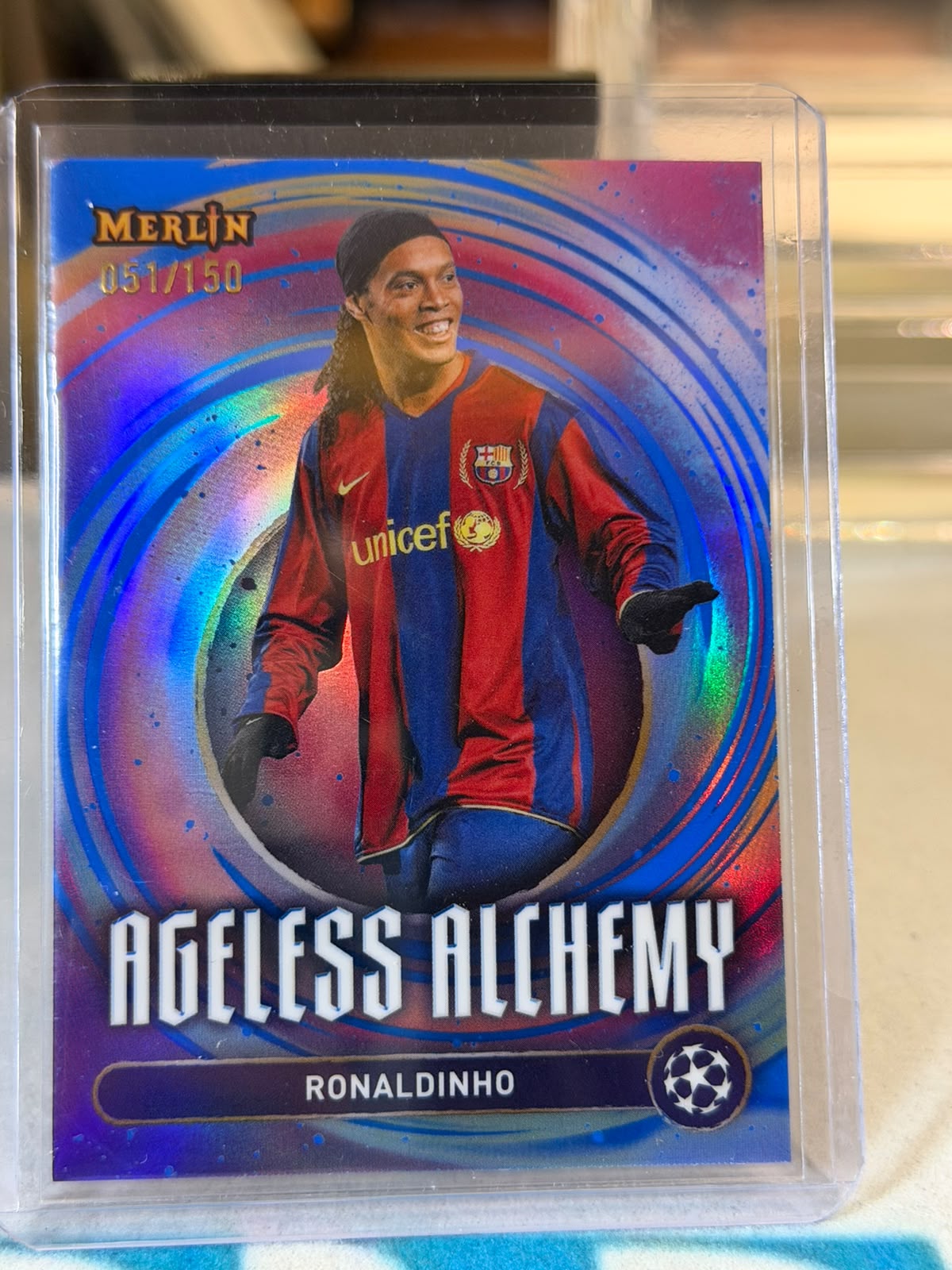 Ronaldinho 051/150 Ageless Alchemy – Topps Merlin UEFA Club Competitions 2024/25 – FC Barcelona trading card, front