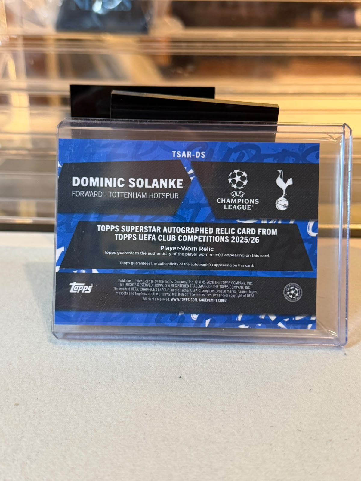 Dominic Solanke Tottenham Superstar Autographed Relic card back, 2025/26 Topps UEFA Club Competitions #TSAR-DS, serial 12/25