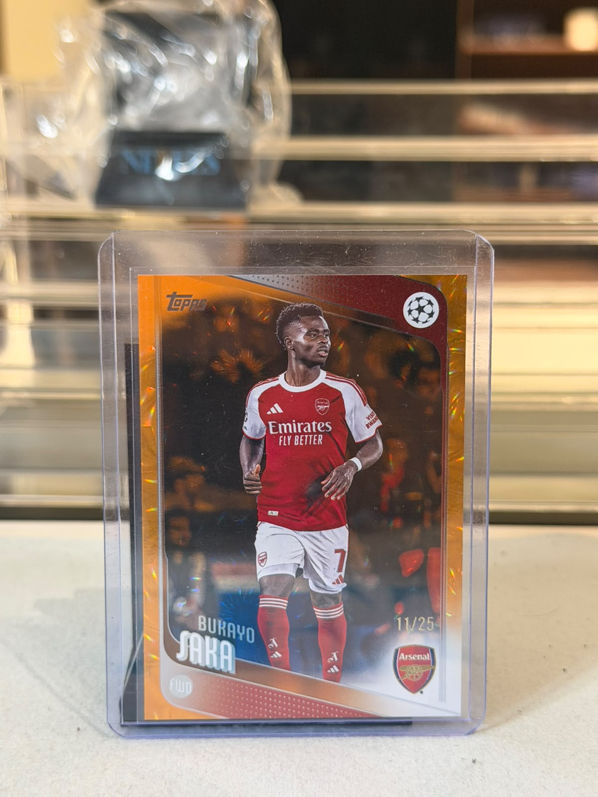 Bukayo Saka front - 2025-26 Topps UEFA Champions League Orange Sparkle Crystal #12 11/25