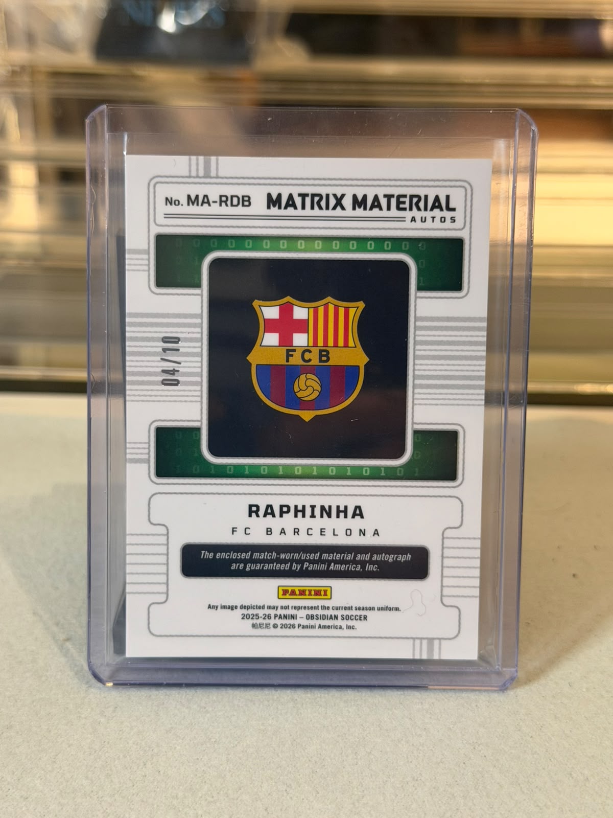 Raphinha FC Barcelona 2025-26 Panini Obsidian Matrix Material Autos Gold parallel #MA-RDB 04/10 autograph relic card back