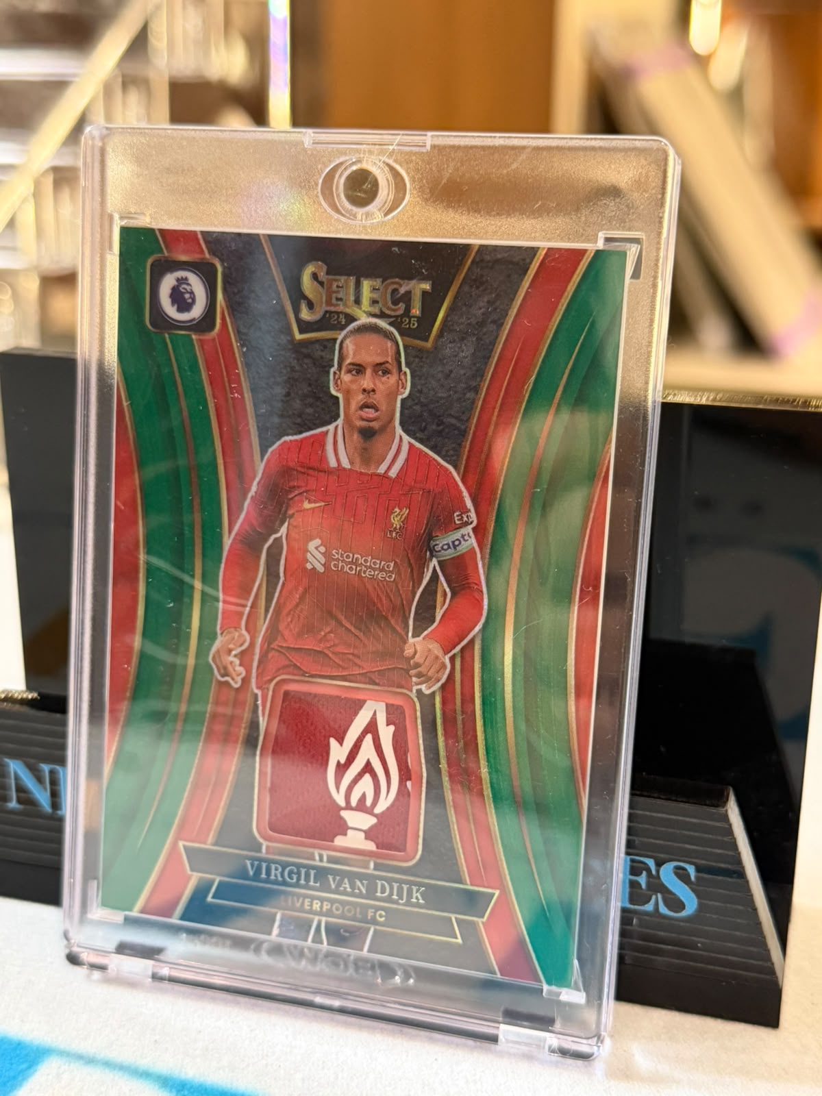 Virgil van Dijk 1/2 Prizm Memorabilia relic (SM-VVD), crest die-cut – 2024-25 Panini Select PL Soccer, front