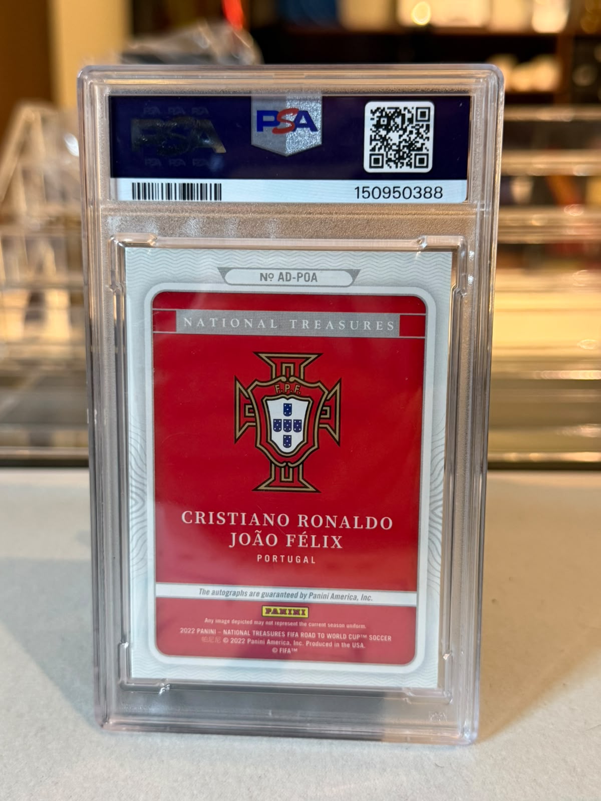 PSA graded slab back showing cert number 150950388, card number AD-POA, Cristiano Ronaldo and Joao Felix Portugal National Treasures autograph card