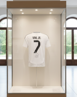 White sports jersey with 'Vini Jr.' and number '7' on a white background