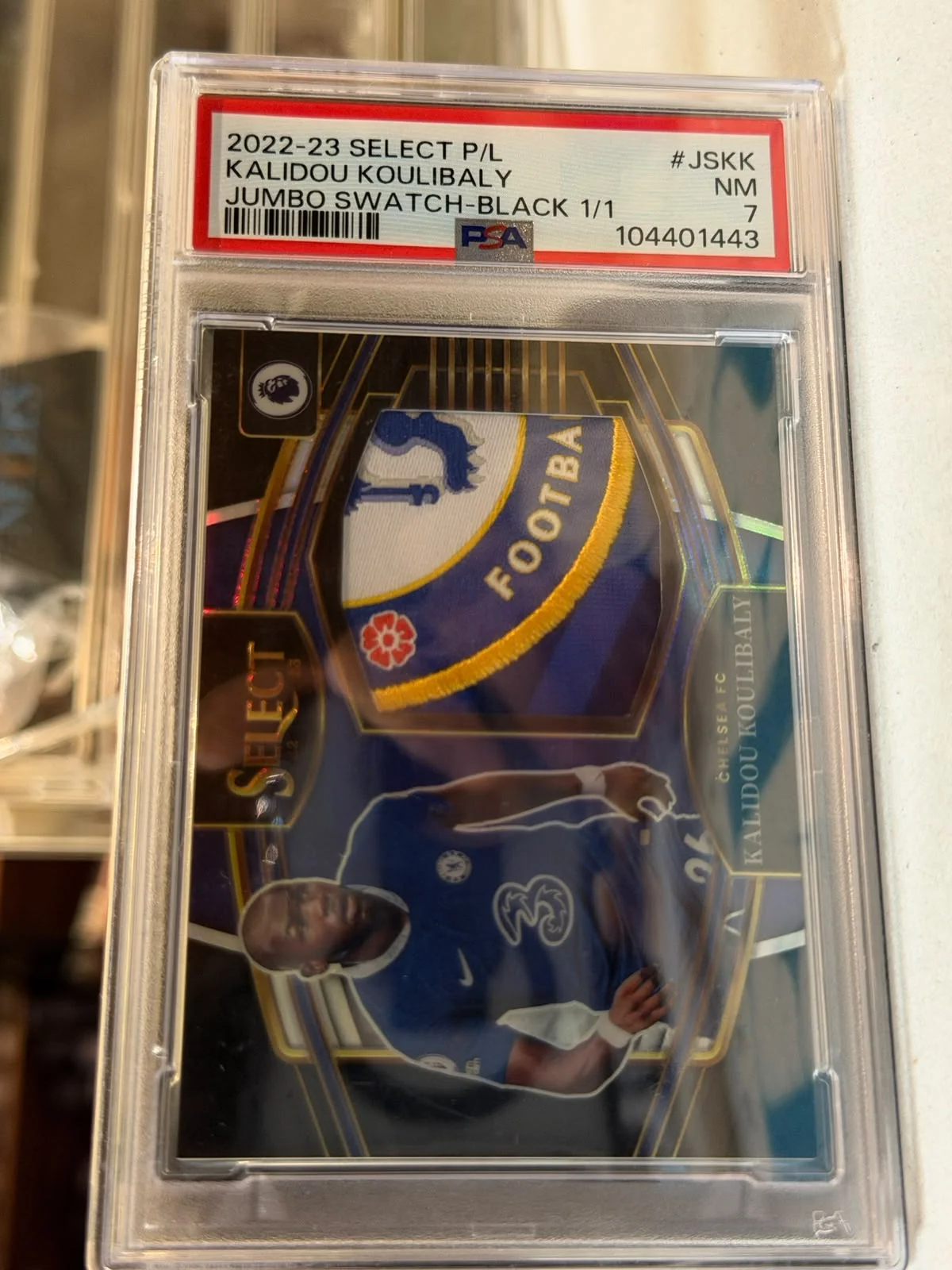 Kalidou Koulibaly 1/1 Jumbo Swatch Patch (Black) – 2022-23 Panini Select (PSA 7) – Chelsea trading card, front