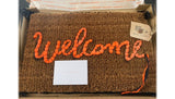 Banksy's "Welcome Mat" hand-stitched from life jacket material, full view