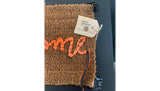 Banksy's "Welcome Mat" shown in its original packaging
