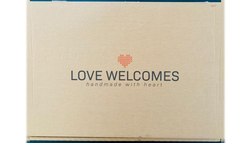 Numbered series label 588/1000 on Banksy's "Welcome Mat"