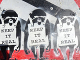 Close-up of the printed signature on "Keep It Real", attributed to Banksy