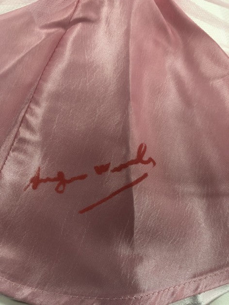 Detail of fabric condition on the Andy Warhol signed Barbie dress