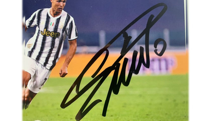 Close-up detail of the printed photograph signed by Cristiano Ronaldo
